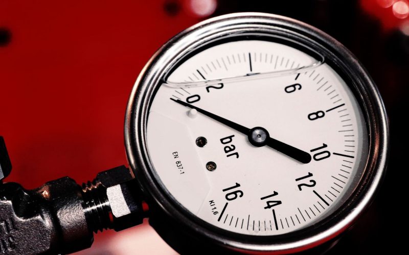 Close-up of an air pressure gauge showing the bar scale