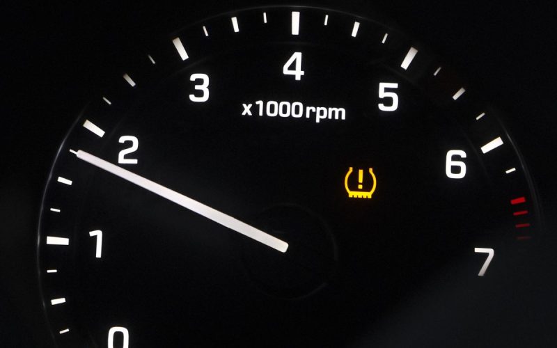TPMS tire pressure warning light on a car dashboard